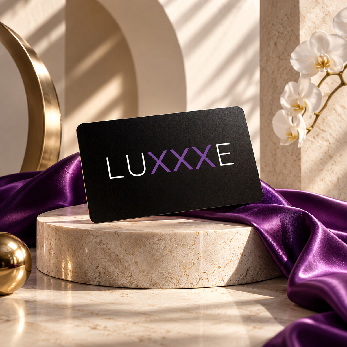 LUXXXE digital gift card displayed in an elegant marble setting