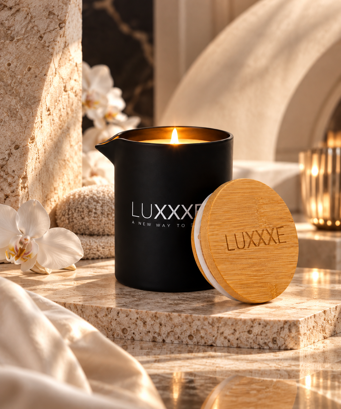 LUXXXE Aura massage candle displayed in an elegant spa-inspired setting