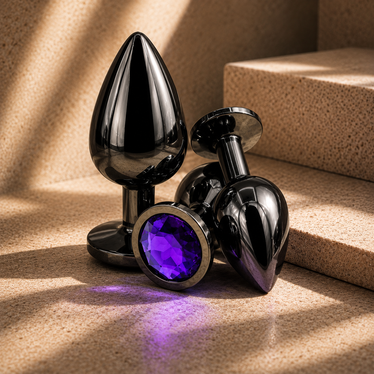 LUXXXE Noir stainless steel plug set showcasing three graduated sizes