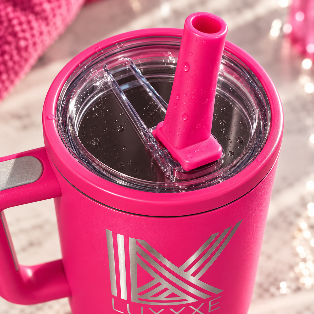 LUXXXE Vertex 40 oz tumbler highlighting its flip straw lid