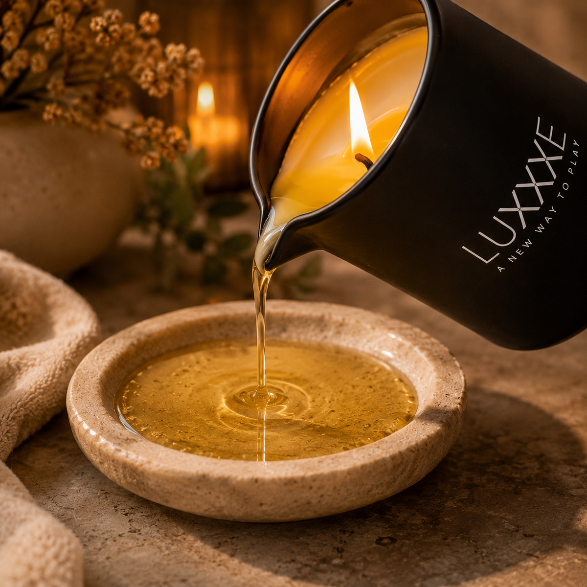 LUXXXE Aura massage oil candle highlighting warm pourable massage oil