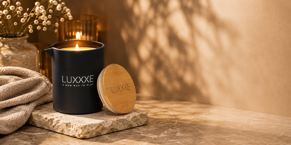 LUXXXE Aura massage oil candle in an elegant spa-inspired setting