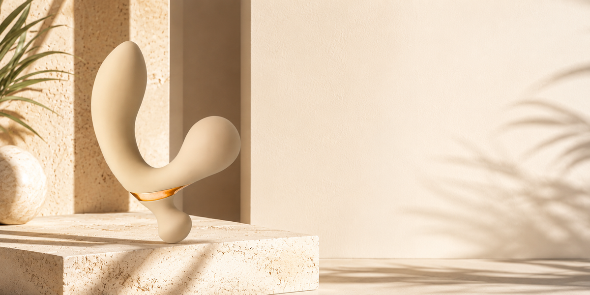 LUXXXE Moto dual-stimulation vibrator in a sophisticated luxury setting